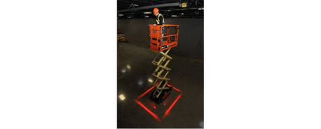 A man in a JLG Scissor Lift demonstrating their all new perimeter lighting kits.