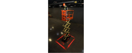 A man in a JLG Scissor Lift demonstrating their all new perimeter lighting kits. 